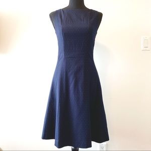 Dark blue A-line dress with small polka dots